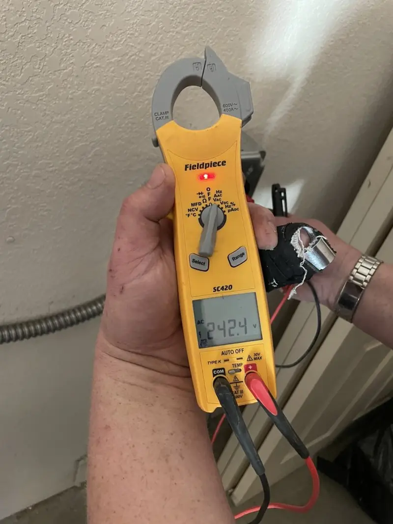Voltage testing with clamp meter during Aluminum Wiring Replacement in Walker